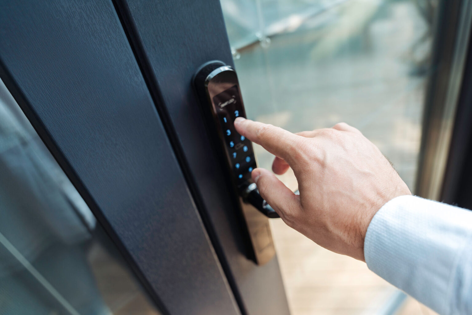 Hand using security key card unlocking the door to entering private building . Home and building security system