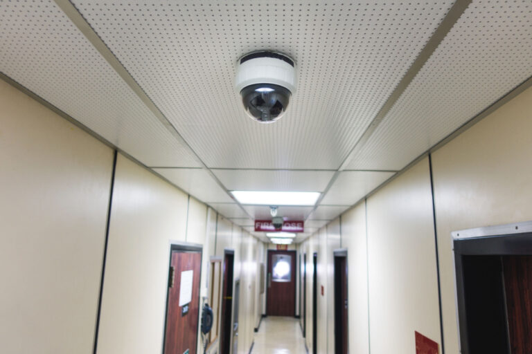 CCTV system security camera or cctv camera on ceiling in apartment room or living quarter.